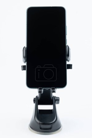 Modern smartphone in car mount holder front view isolated