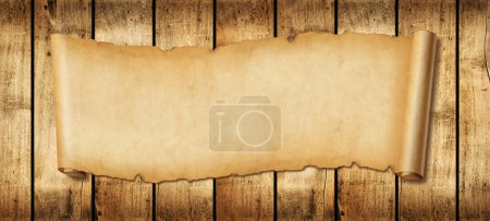Foto de Banner horizontal de papel viejo. Desplazamiento del pergamino sobre un fondo de tablero de madera - Imagen libre de derechos