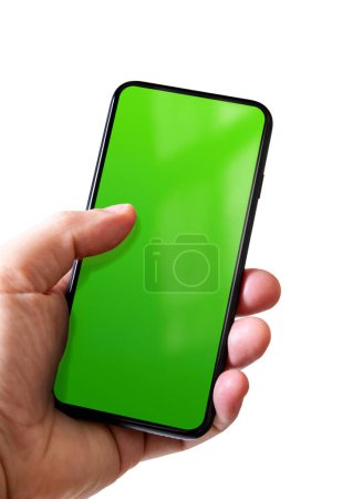 Foto de Mano sosteniendo un teléfono inteligente con pantalla verde en blanco. Aislado sobre fondo blanco. - Imagen libre de derechos