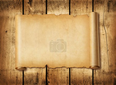 Photo for Old mediaeval paper sheet. Horizontal parchment scroll on a wood board background - Royalty Free Image