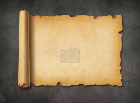 Photo for Old mediaeval paper sheet. Horizontal parchment scroll on a concrete wall background - Royalty Free Image