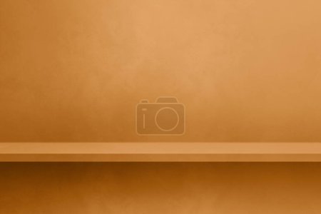 Foto de Empty shelf on a yellow ocher concrete wall. Background template scene. Horizontal mockup - Imagen libre de derechos