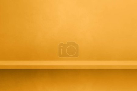 Foto de Empty shelf on a yellow gold concrete wall. Background template scene. Horizontal mockup - Imagen libre de derechos