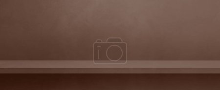 Photo for Empty shelf on a chocolate brown concrete wall. Background template scene. Horizontal banner mockup - Royalty Free Image