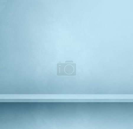 Foto de Empty shelf on a light blue concrete wall. Background template scene. Square mockup - Imagen libre de derechos