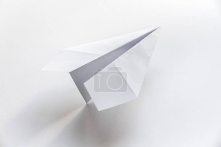 Photo for Paper plane origami isolated on a blank white background - Royalty Free Image