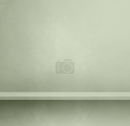 Téléchargez les photos : Étagère vide sur un mur de béton vert clair. Scène modèle d'arrière-plan. Maquette carrée - en image libre de droit
