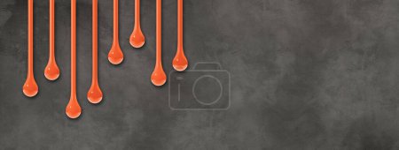 Téléchargez les photos : Des gouttes d'encre orange isolées sur un mur en béton foncé. Bannière horizontale. Illustration 3D - en image libre de droit