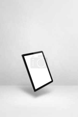 Téléchargez les photos : Tablette vierge pc ordinateur flottant sur un fond blanc. Illustration 3D isolée. Modèle vertical - en image libre de droit
