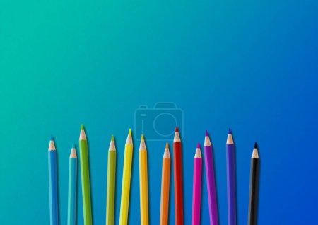 Photo for Wooden colored pencil set isolated on blue. Horizontal background. - Royalty Free Image
