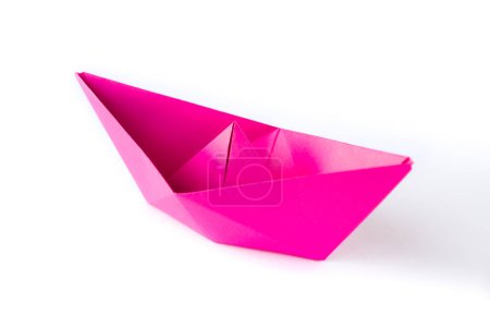 Foto de Pink paper boat origami isolated on a blank white background. - Imagen libre de derechos