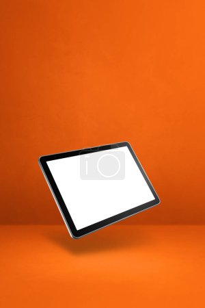Photo for Blank tablet pc computer floating over an orange background. 3D isolated illustration. Vertical template - Royalty Free Image