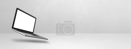 Photo for Blank computer laptop floating over a white background. 3D isolated illustration. Horizontal banner template - Royalty Free Image
