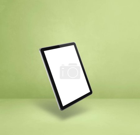 Téléchargez les photos : Tablette vierge pc ordinateur flottant sur un fond vert. Illustration 3D isolée. Modèle carré - en image libre de droit
