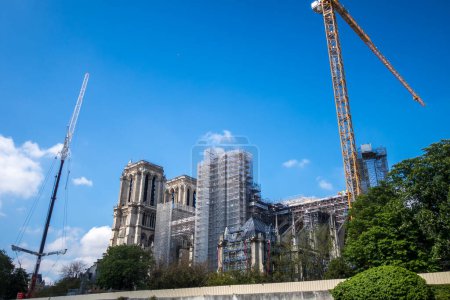 Photo for Paris - France - May 02, 2023 : Reconstruction of Notre-Dame de Paris cathedral on the Ile de la Cite. View from the Seine river banks - Royalty Free Image