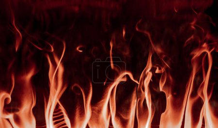 Photo for Flames in fireplace. Texture background isolated on a black background - Royalty Free Image