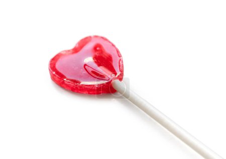 Photo for Shiny red heart shaped lollipop isolated on white background - Royalty Free Image