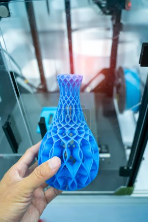 Photo for Hand with vase closeup object printed 3d printer close-up. Progressive modern additive technology 4.0 industrial revolution - Royalty Free Image