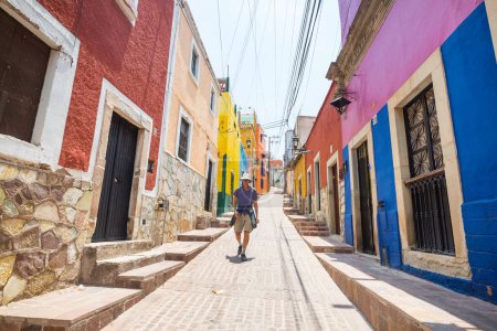 Photo for Tourist on colorful street in the famous city of Guanajuato, Mexico - Royalty Free Image