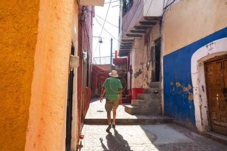 Photo for Tourist on colorful street in the famous city of Guanajuato, Mexico - Royalty Free Image