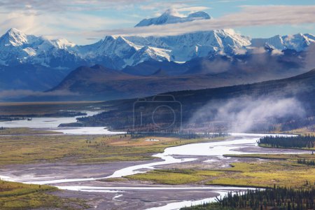 Photo for Picturesque Mountains of Alaska in summer. Snow covered massifs, glaciers and rocky peaks. Beautiful natural background. - Royalty Free Image