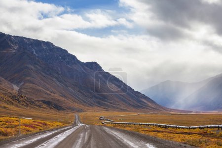 Photo for USA, Alaska, Dalton Highway pipeline in valley - Royalty Free Image