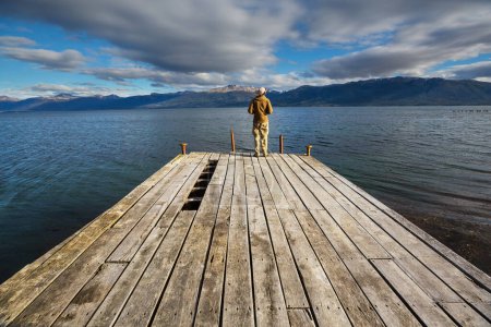 Photo for Man at the end of the world- beautiful natural landscape around Beagle sound in Ushuaia, Argentina - Royalty Free Image