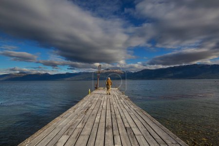 Photo for Man at the end of the world- beautiful natural landscape around Beagle sound in Ushuaia, Argentina - Royalty Free Image