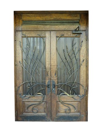 Foto de Puerta antigua de madera marrón vintage con decoración forjada aislada sobre fondo blanco - Imagen libre de derechos