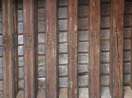 Photo for Aged beams in an old barn. Old roof achitecture detail. Wooden timbers. - Royalty Free Image