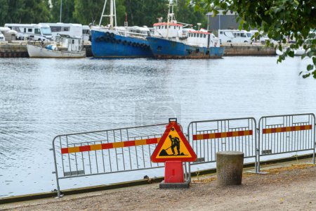 Photo for Road works sign on Nissan river promenade in Halmstad, Sweden. Selective focus. - Royalty Free Image