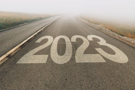 Photo for 2023 new year uncertainty, number on asphalt road to infinity disappearing in foggy diminishing perspective, selective focus - Royalty Free Image
