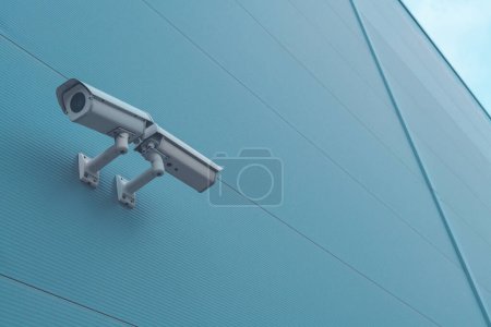 Photo for Outdoor surveillance security camera mounted on industrial building wall to monitor the activity outside the premises - Royalty Free Image