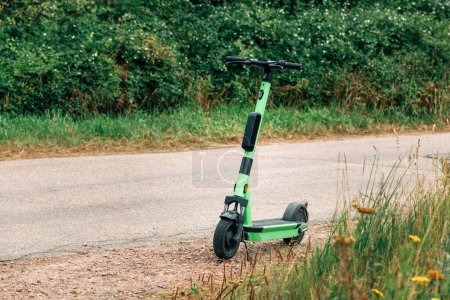 Foto de E-scooter for rent by the road in Halmstad, Sweden. Selective focus. - Imagen libre de derechos