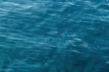 Photo for Drizzle rain concentric circles on sea water surface during storm - Royalty Free Image