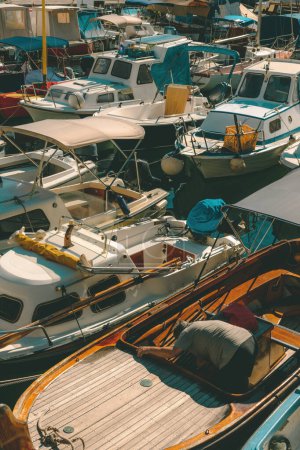 Photo for Fishing boats moored in small marina in town of Lovran, Croatia. Selective focus. - Royalty Free Image