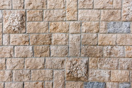Photo for Stone tiled facade wall of a building as background - Royalty Free Image