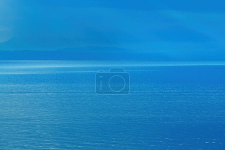 Photo for Morning sunlight beaming through clouds at Kvarner gulf of Adriatic sea in Croatia - Royalty Free Image
