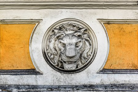 Photo for Lion head concrete mold as decorative detail of an old wall, architectural feature - Royalty Free Image