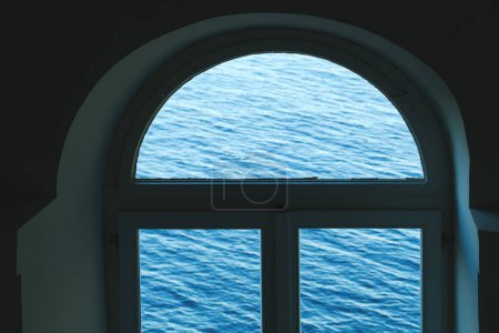 Photo for Old arched window with view of the sea, selective focus - Royalty Free Image