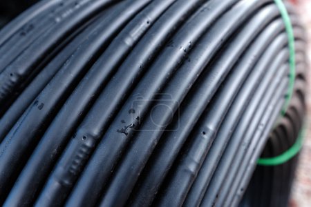 Photo for Closeup of drip irrigation tubing in a roll, selective focus - Royalty Free Image