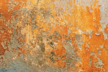 Photo for Damaged old orange house facade wall with paint peeling off as grunge background - Royalty Free Image