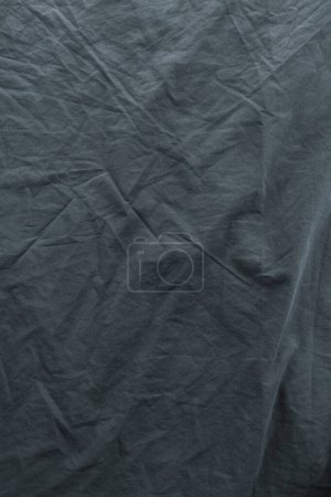 Photo for Wrinkled gray bed sheets as background, directly above - Royalty Free Image