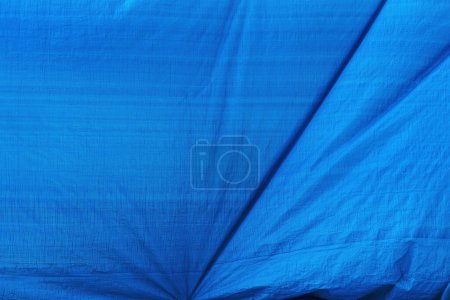Téléchargez les photos : Porté surface de matériau de bâche bleue comme fond et texture industrielle, image horizontale - en image libre de droit