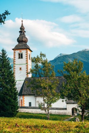 Photo for Church of St. John the Baptist on the hill by lake Bohinj, one of the main tourist attraction in Triglav national park built more than 700 years ago, selective focus - Royalty Free Image