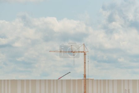 Photo for Construction crane on building site, industry and architecture concept, minimalistic composition - Royalty Free Image