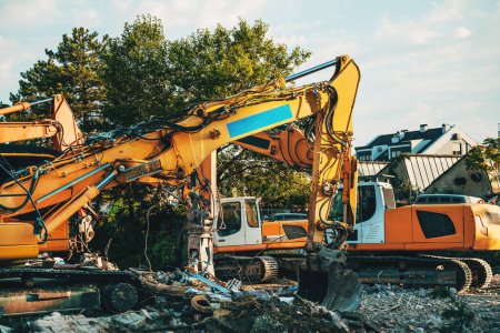 Photo for Construction machinery on site, demolishing old building, selective focus - Royalty Free Image
