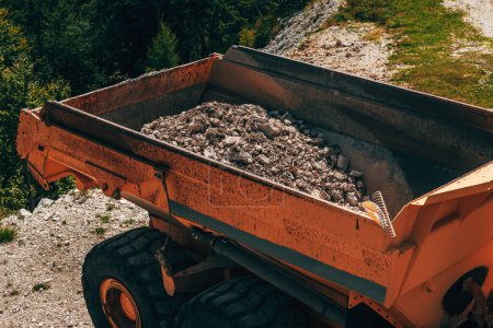 Photo for Dump truck trailer filled with rubble and gravel, high angle view, selective focus - Royalty Free Image