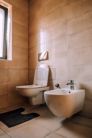 Photo for Toilet and bidet in modern bathroom, selective focus - Royalty Free Image