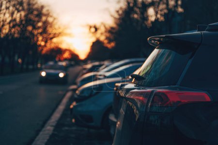 Photo for Cars on parking lot in sunset, selective focus - Royalty Free Image